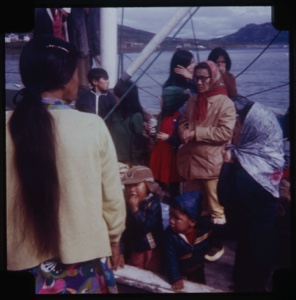 Image of Eskimos [Inuit] aboard fishing boat