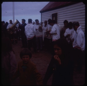 Image: Eskimo [Inuit] band members at ease outside church