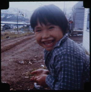 Image of Eskimo [Inuk] boy with big grin