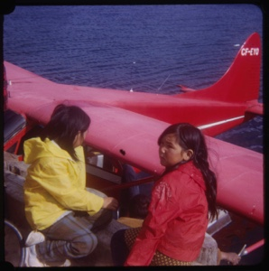 Image of Two Eskimo [Inuit] girls by seaplane