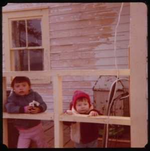 Image: Two children looking through railing
