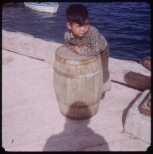 Image of Eskimo [Inuk] boy on dock