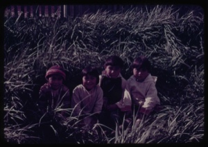 Image: Four Eskimo [Inuit] children sitting on grass