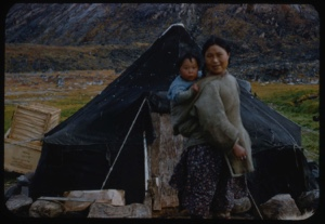 Image of Eskimo [Inuit] mother and child by tent