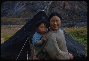 Image of Eskimo [Inuit] mother and child by tent