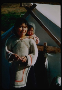 Image of Eskimo [Inuk] mother with child on her back