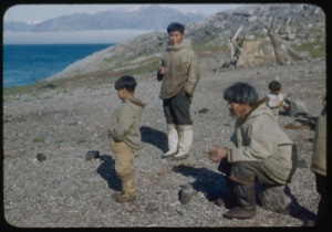 Image of Eskimo [Inuit] men and boys on the beach