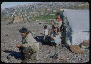 Image of Eskimo [Inuit] family by sealskin tent