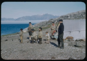 Image of Eskimo [Inuit] family and Donald MacMillan by tent