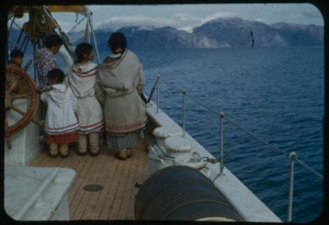 Image: Eskimo [Inuit] woman and children by the wheel