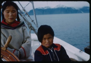 Image of Two Eskimo [Inuit] children by wheel
