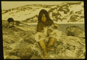 Image of Eskimo [Inuk] boy holding live eider