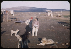 Image of Miriam MacMillan, Eskimo [Inuk] woman with dogs