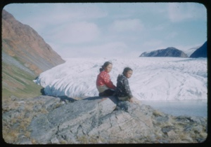 Image: Young women and boy sitting by Brother John's Glacier