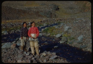 Image of Young women and boy by stream