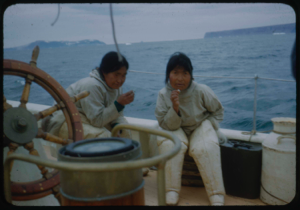 Image of Two Eskimo [Inuit] women smoking, aboard
