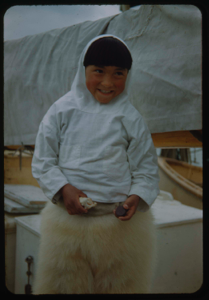Image of Eskimo [Inuk] boy in bearskin pants, aboard
