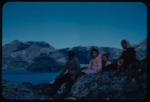 Image: Group of Eskimos [Inuit] on rocks