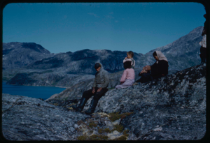 Image of Group of Eskimos [Inuit] on rocks