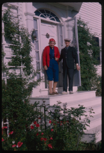 Image: Miriam and Donald MacMillan at their front door