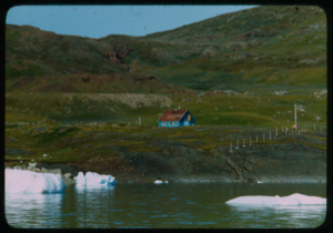 Image: Frame building near water. Dying icebergs