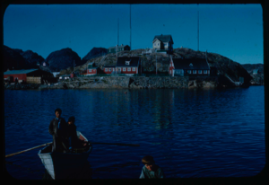 Image: Village. Inuit in dories in foreground