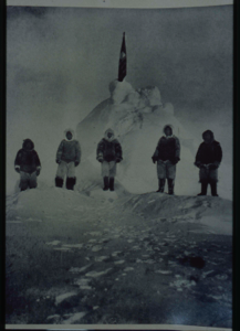 Image of Matthew Henson and four Inuit at the Pole