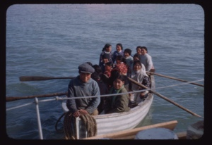 Image of Eskimos [Inuit] arriving by boat