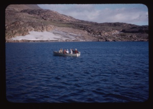 Image of Miriam and Donald MacMillan with Eskimos [Inuit] in open boat