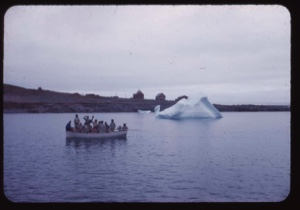 Image: Eskimos [Inuit] in open boat waving goodbye