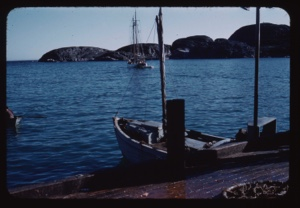 Image of Boat at dock; The Bowdoin leaving