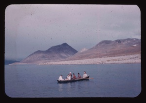 Image of Group in open boat. May include Miriam MacMillan