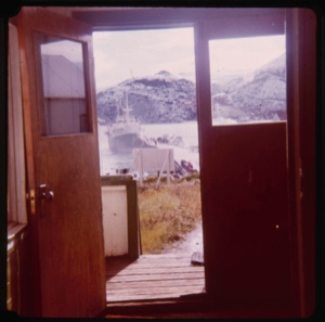 Image: Mail boat seen through open door