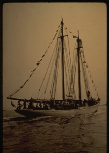 Image of Bowdoin under power, guests aboard
