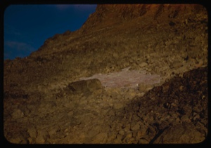 Image of Red snow on cliff