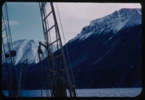 Image of Snow-capped coastal mountains through rigging