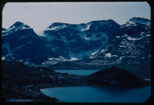 Image: Coastal mountains with snow pockets, and harbor