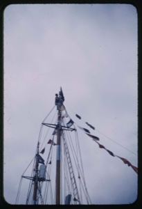 Image: Peter Rand placing admiral's flag on mast