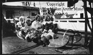 Image: Donald MacMillan, George Borup, Tom Gushue, and Matthew Henson on sledge aboard ship