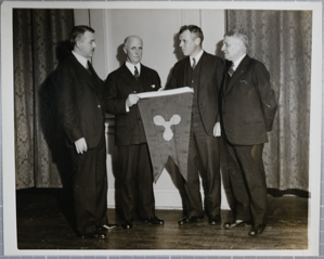 Image: [Donald MacMillan receiving Propeller Club flag]