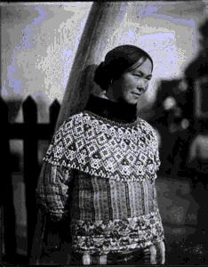 Image of Eskimo [Inuk] woman wearing bead collar