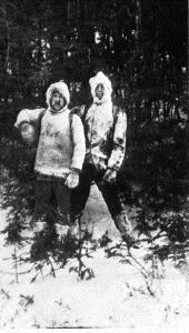 Image of [? and Donald MacMillan "iced up" in snowy woods]