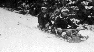 Image of [? and Donald MacMillan on toboggan, with gear]
