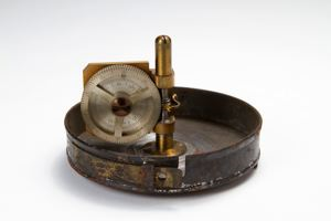 Image of Odometer in canister with leather thong