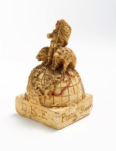 Image: Commemorative figurine from DKE, showing Peary atop globe