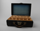 Image of Leather case labeled North Pole lecture, originally filled with 163 glass slides