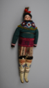 Image of Doll dressed in women's Greenlandic costume of sealskin pants and overblouse, beaded collar