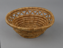 Image of woven grass basket in open work style