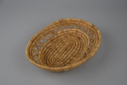 Image of woven grass flat serving basket with open work