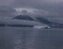 Image of Coastal scenery and fjord, with iceberg, on way to Nugatsiac